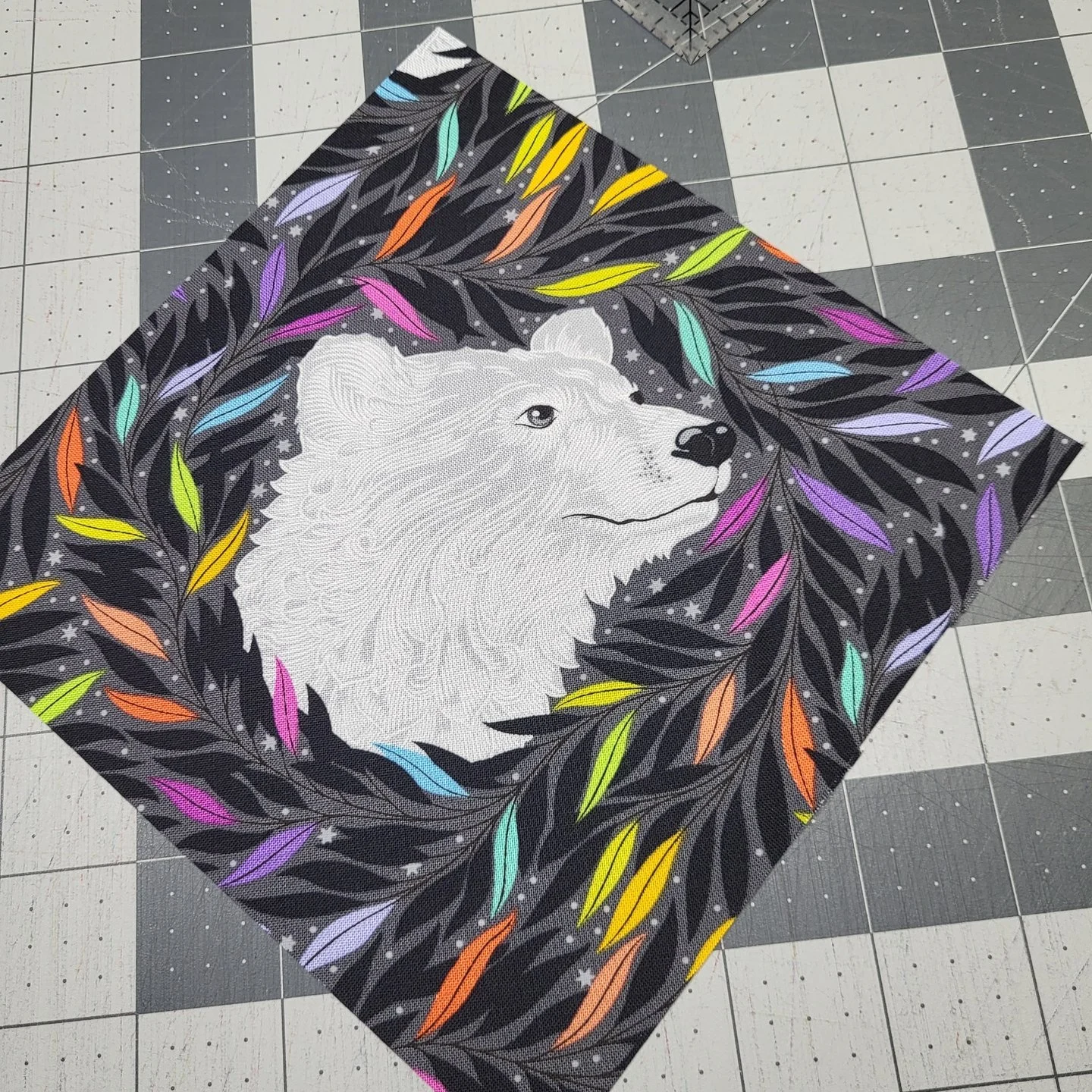 Each animal in this Fade to Grey quilt kit is fussy cut and in order to make every piece look the same, I used a ruler and a dry erase marker. I lined up one of the animals, in this case, the polar bear, just how I wanted it to look, and I drew aroun