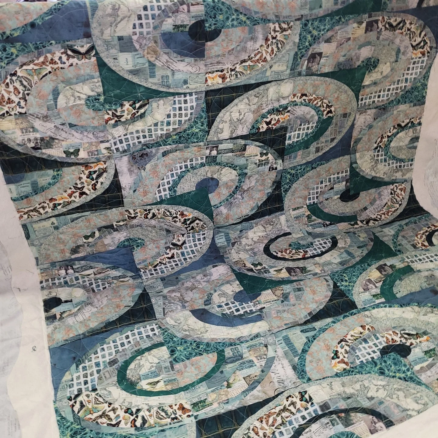 This quilt reminds me of a swirling sea! The teal color palette and curvature of the quilt really gives off that vibe!

I'd never made a quilt with this many curves before, but the payoff was totally worth it!

For the quilting, I chose Ring Toss by 