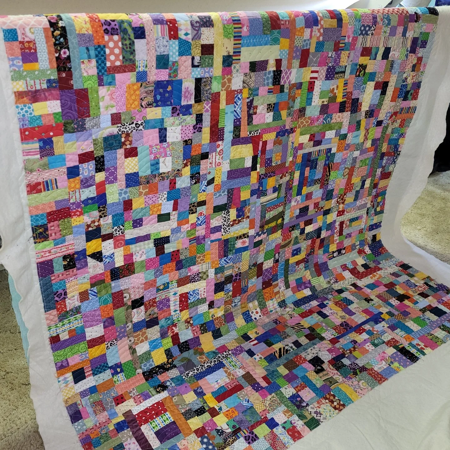 Have you ever made a Crumb quilt? This is the first one I've ever seen and I am blown away!!

Ellen made this masterpiece with bits and pieces of fabric from her projects over the years. It's amazing!!

For the quilting, Ellen chose Baptist Fan and i
