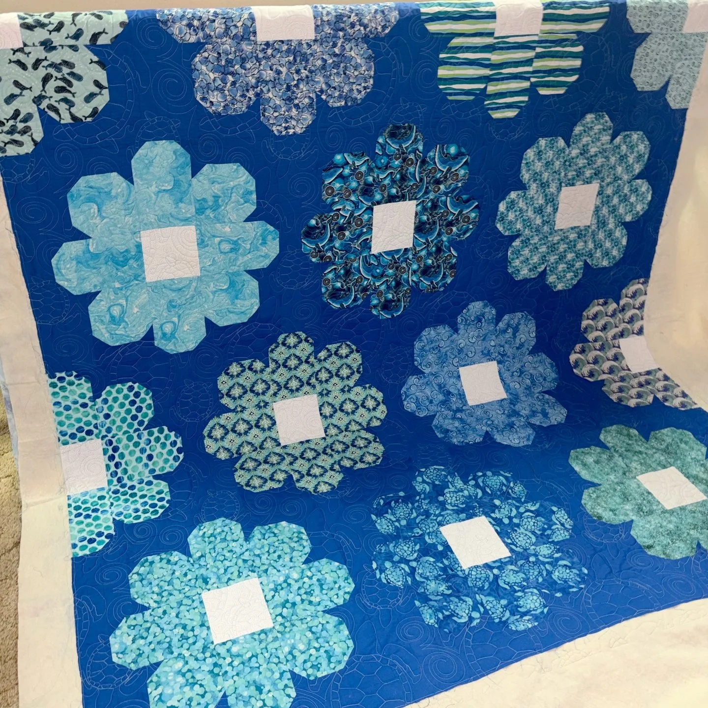 More gifted quilts!! Christine made these next two quilts as Easter gifts for her granddaughters! I turned them ASAP so that she'd have them in time. 🙂 

This quilt is for a sea-turtle-loving little girl and has one of the most intricate, but amazin