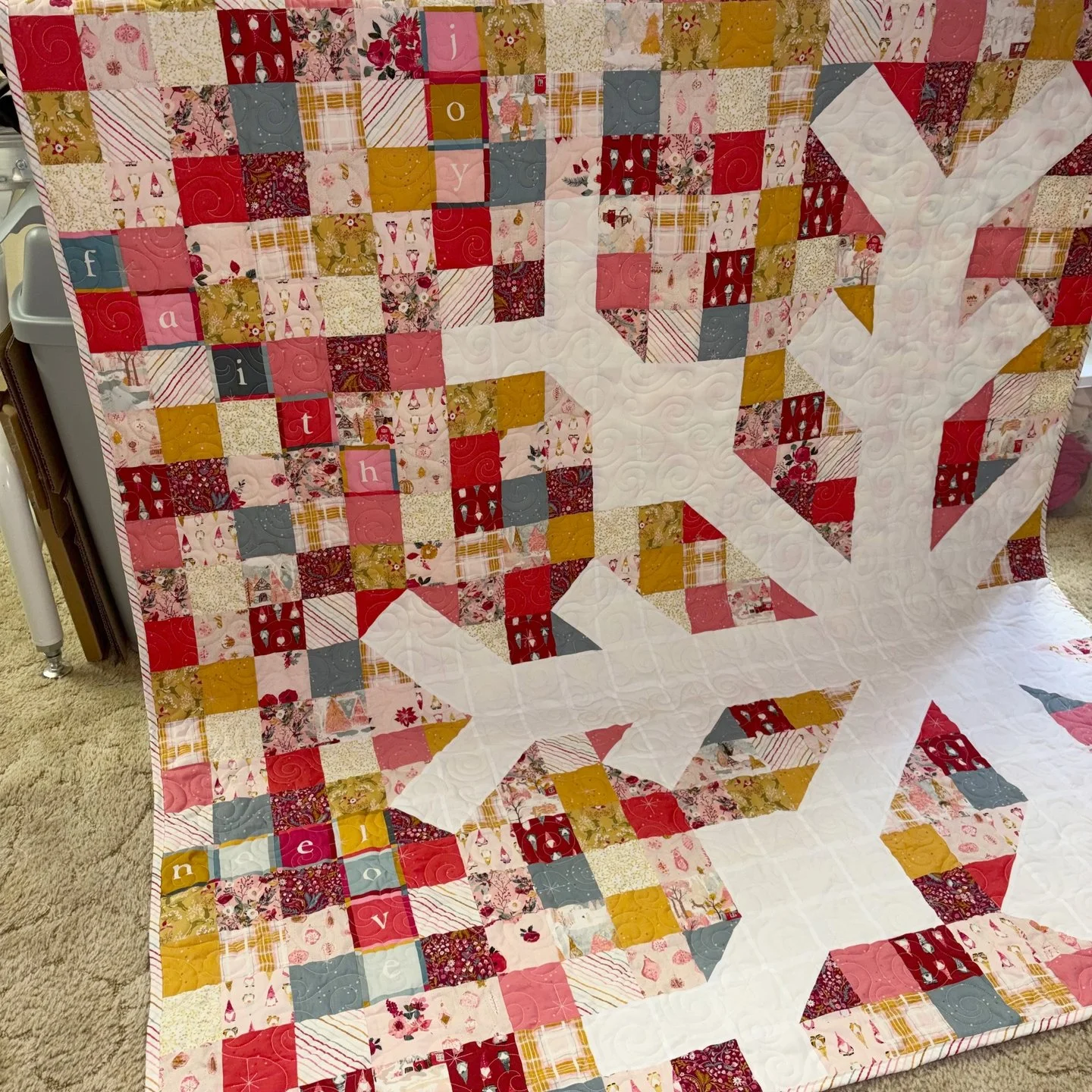 Julie is a fellow NC quilter and new client who sent over this amazing snowflake quilt! If ever there was a Christmas color palette that screamed "ME", it's this one! I love using pink in my Christmas decor, so this quilt was super fun to s