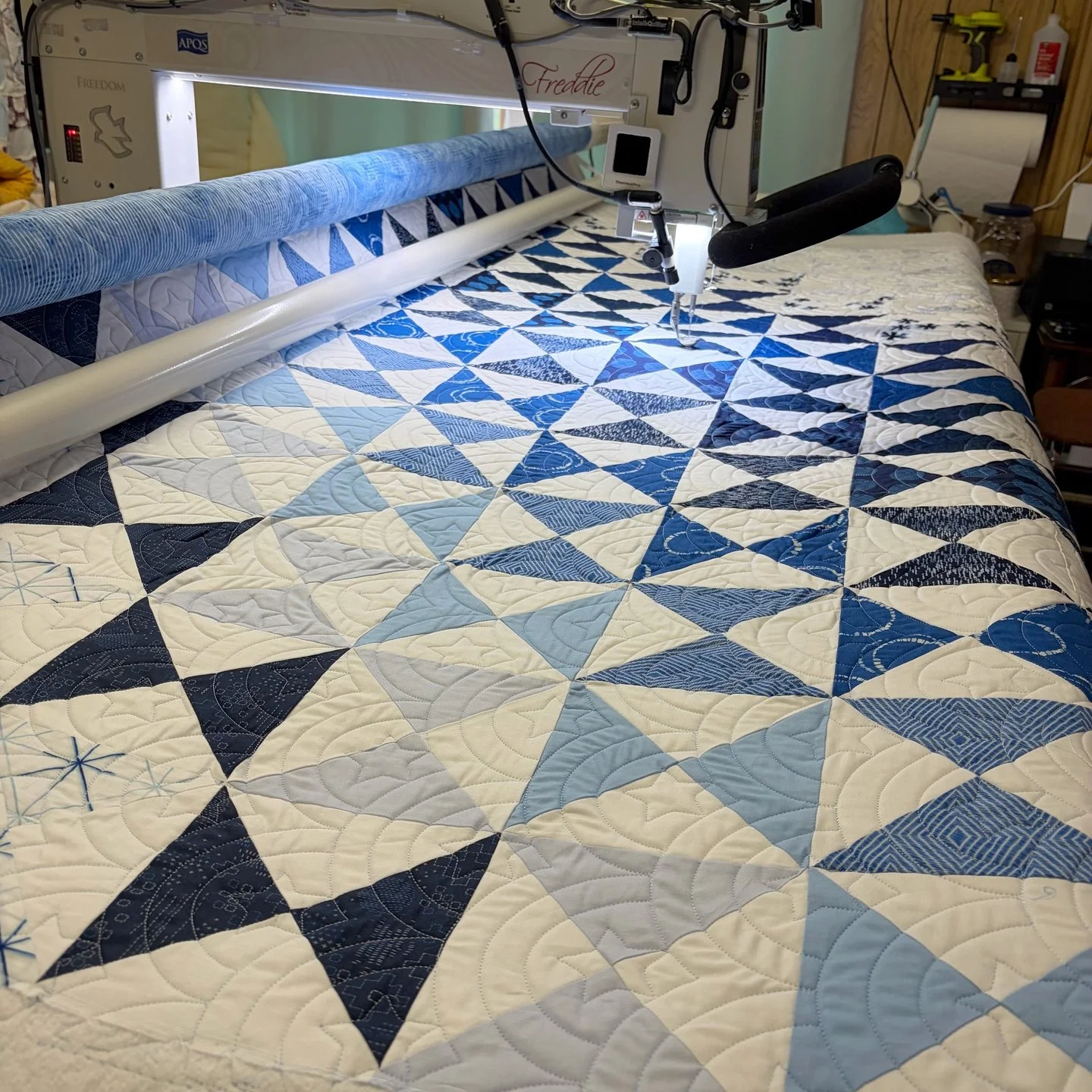 Vicki is another new client who dropped off this amazing blue and white quilt! Like red and white quilts, blue and white quilts are always a classic!

For the quilting, Vicki and her grandson chose Rolling Hills Sparkle. This is a graduation gift for