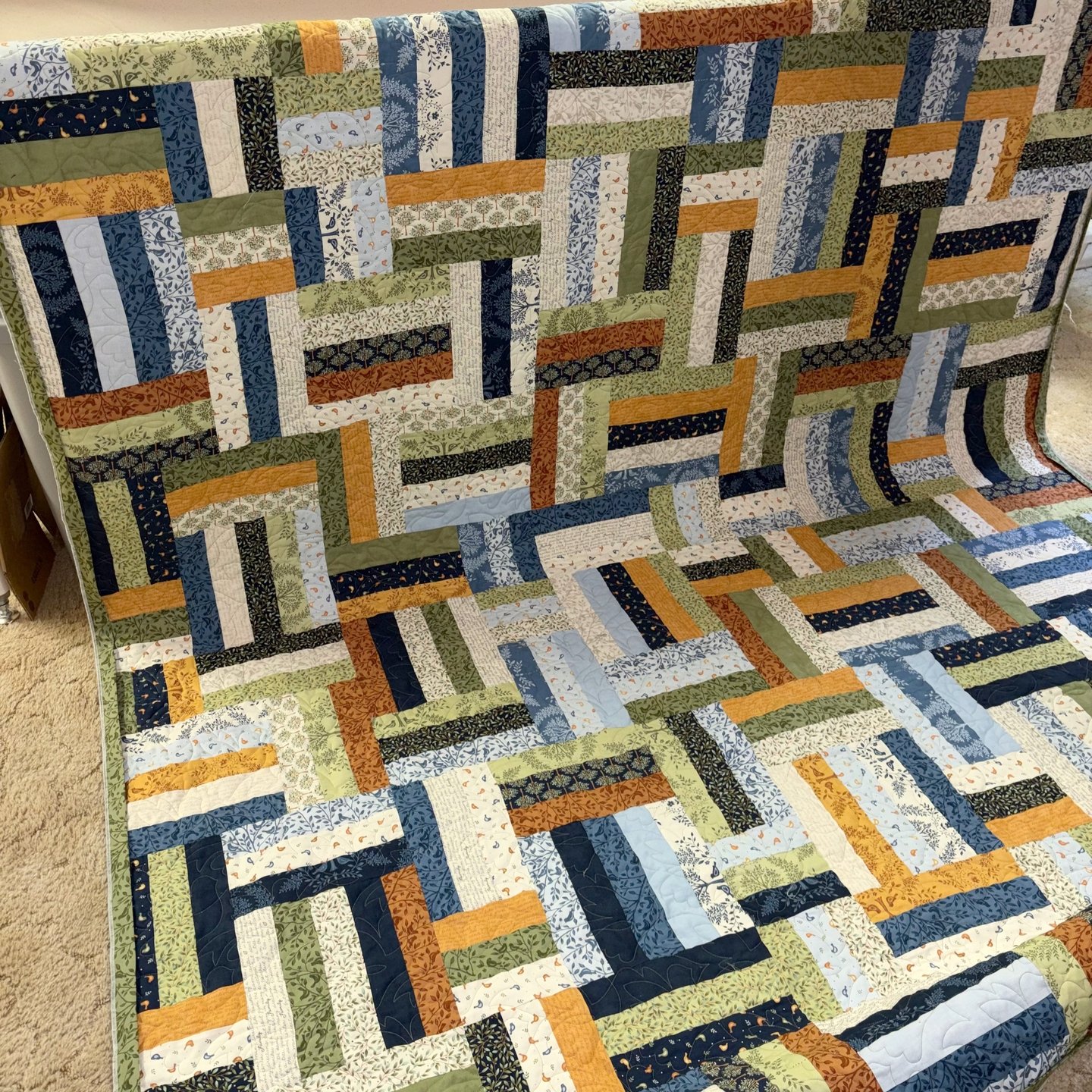 When Dusty brought her quilt to me, she included a spool of thread in the bag.

I use specific thread on my longarm, but Dusty sent along the thread so I could find a close color match to quilt her quilt with. What a great idea! If you have a specifi
