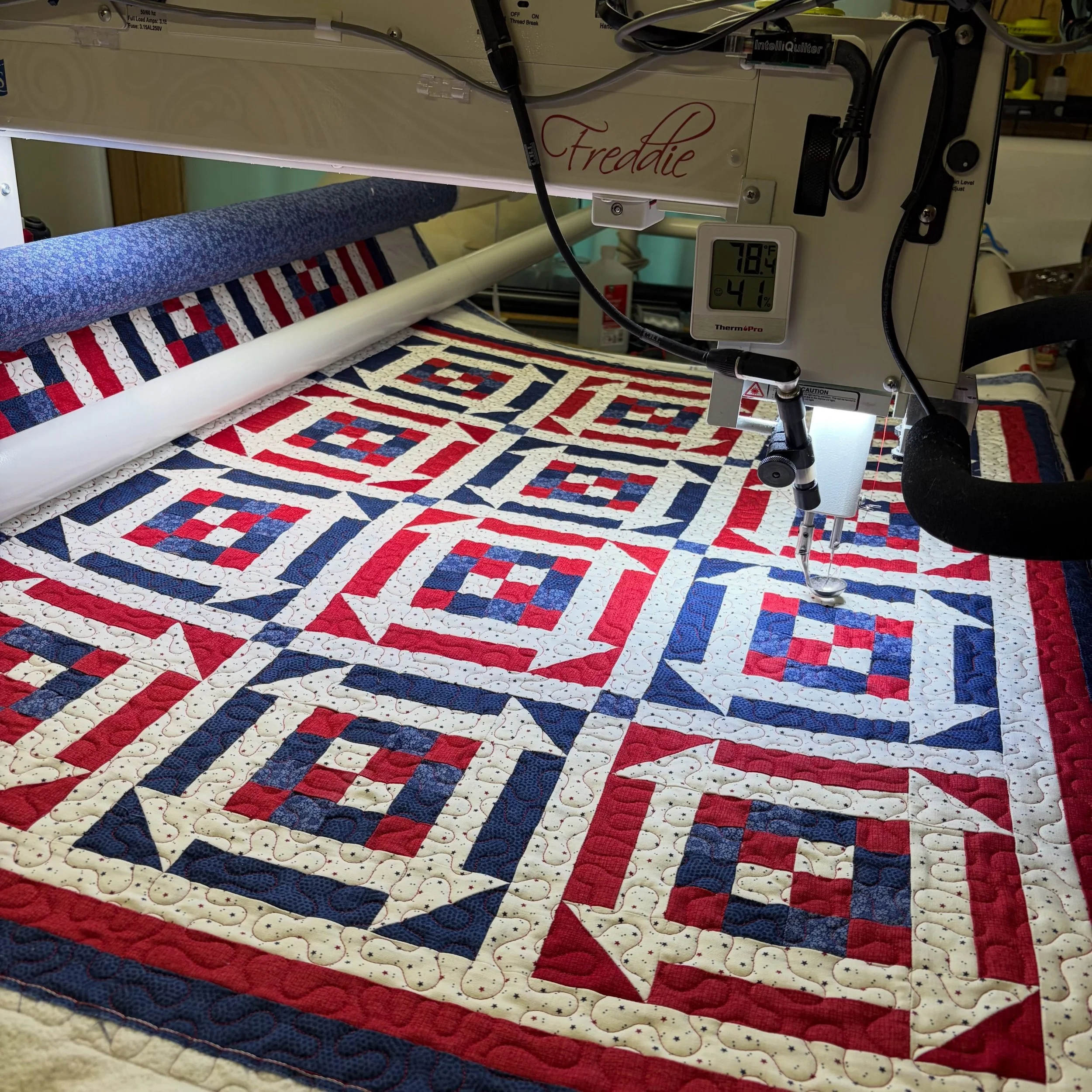 This quilt is hot-off-the-press, as they say! Ellen picked this one up yesterday, just in time for the July 4th weekend!

I love the little bitty churn dash blocks and the alternating red and blue colors. It&rsquo;s so timeless and classic!

Thanks s