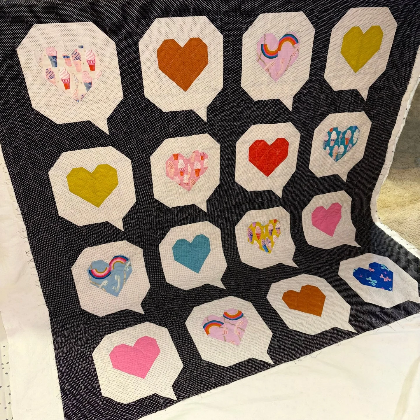 Jenny sent this fun I Heart You quilt for me to quilt and I was so honored when she chose my own pantograph design, Knit Hearts! She leaned into the heart theme with the panto choice and it looks great on her quilt!

I love that Jenny used some fun a