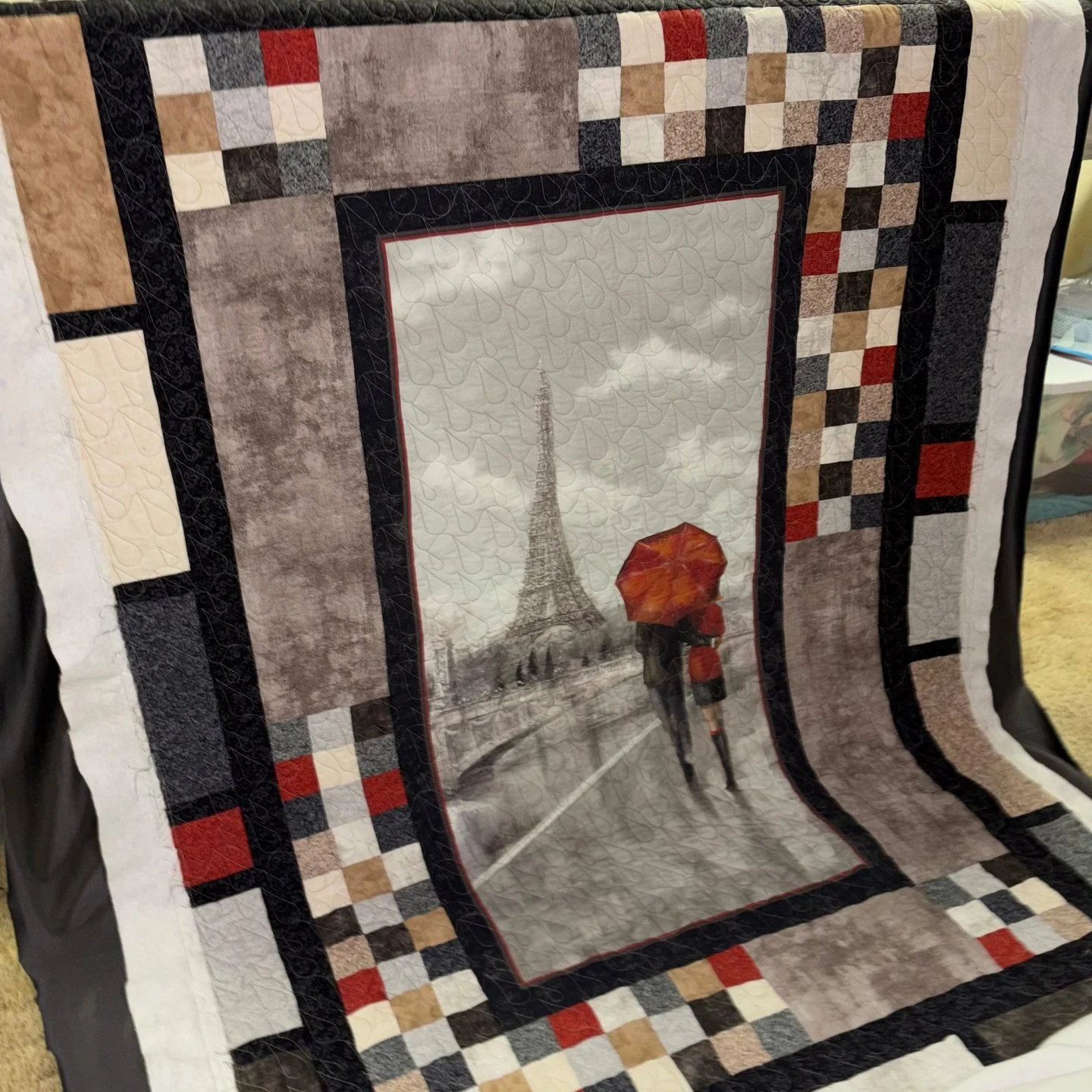 Tina dropped off a batch of quilts and it was so much fun helping her select pantos for them! This one was a gift for her daughter-in-law who loves Paris!

I added a rain pantograph to it and it looks amazing - especially that minky on the back!

Chr
