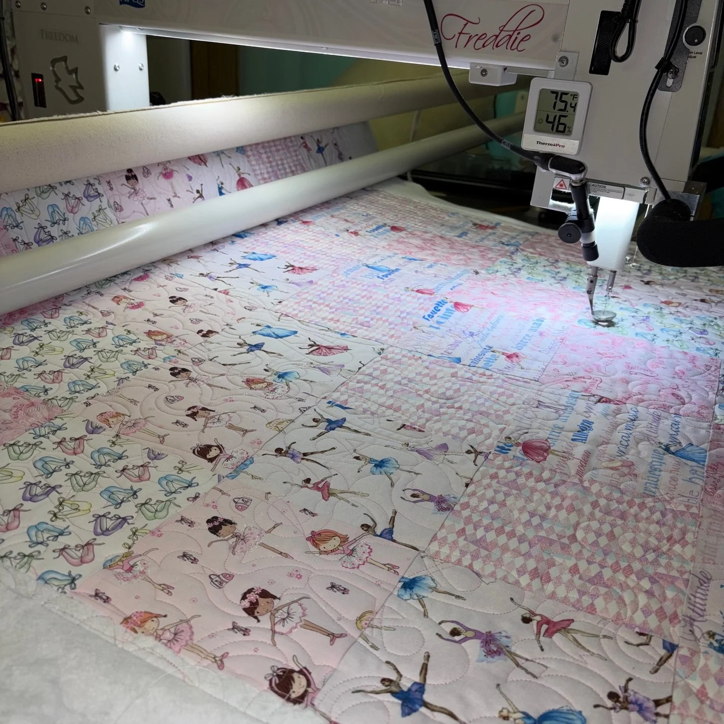 Tina must have an impressive fabric collection because I'm always amazed by all of the different prints in her quilts! She really knows how to coordinate fabrics and this one is no different!

This sweet ballerina quilt is going to one of Tina's neig