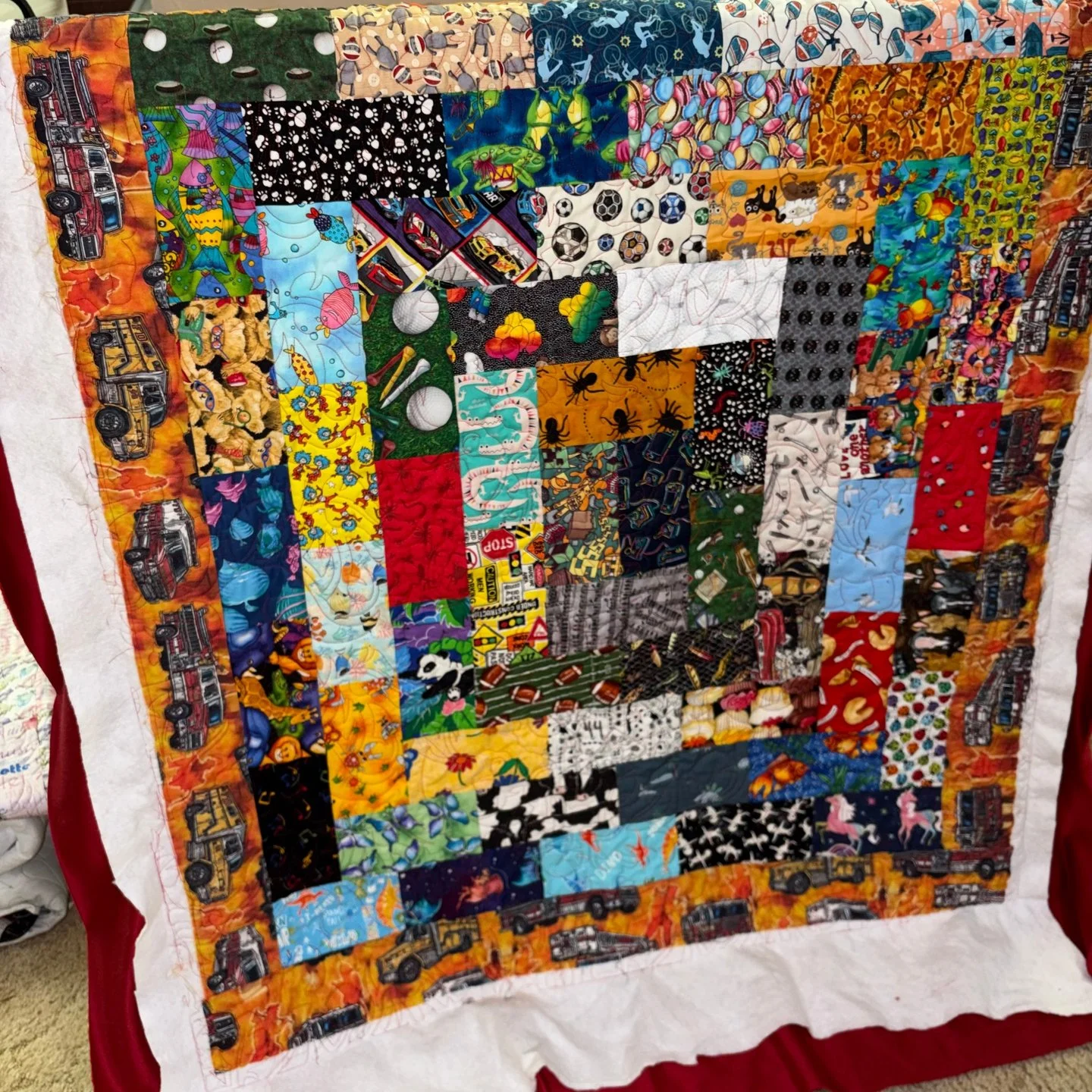 Tina made this amazingly vibrant scrappy quilt and decided to add dinosaurs to it with the quilting - how fun!

Maker: Tina @mothermayhem55
Pantograph: Dino Jungle

#pieceofhomequilts #pohquilts #glidethread #computerizedquilting #apqsfreddie #apqsqu