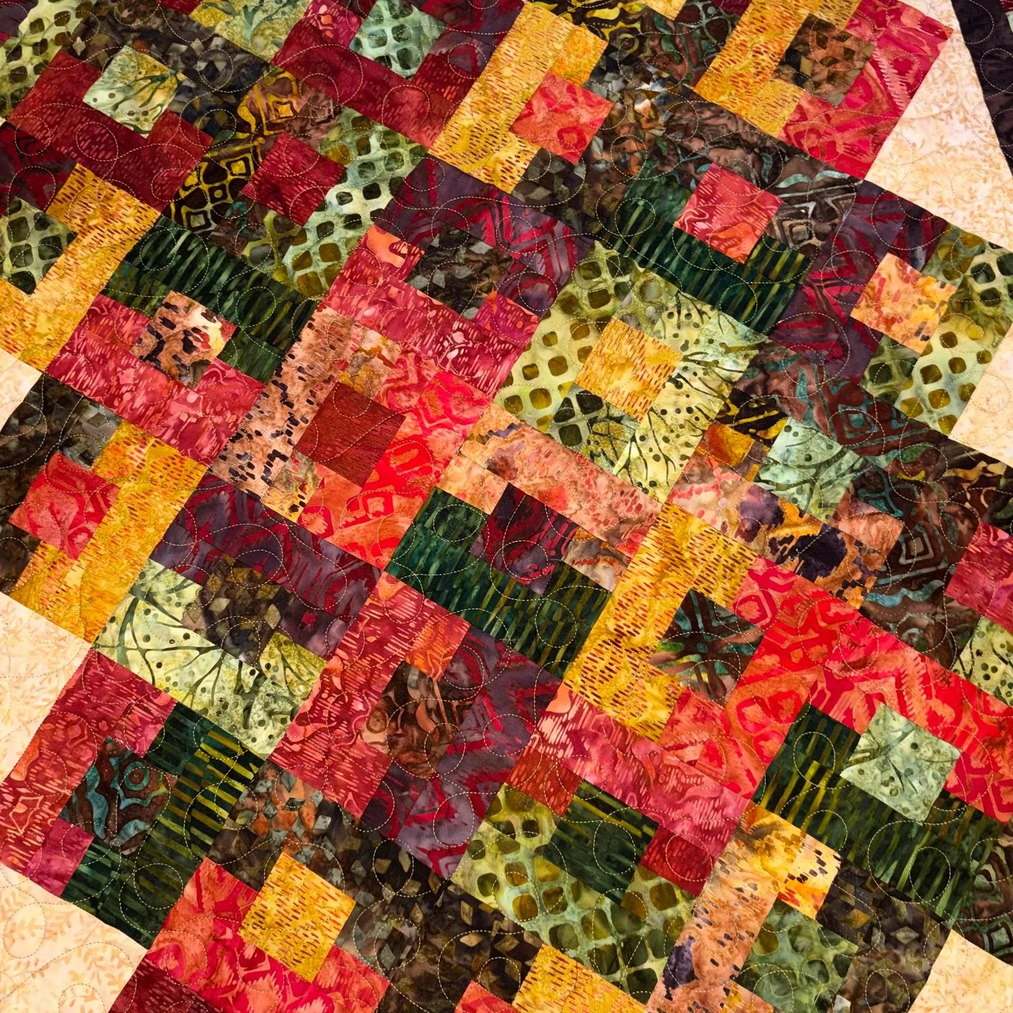 Debra made this beautiful fall-colored quilt and I had so much fun quilting for it! The colors are gorgeous and perfect for this time of year!

Tina made another I-Spy style quilt with so many fun prints! For the quilting, she chose Dino Jungle and i