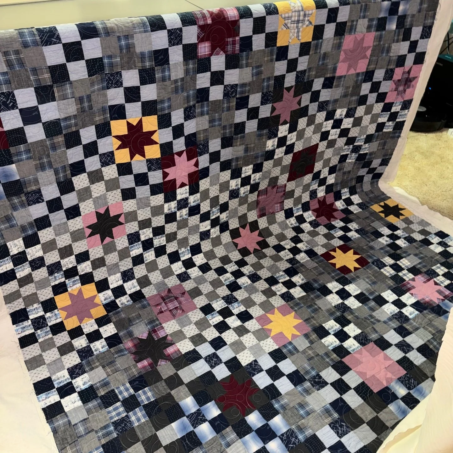 I feel like there's always a need for masculine quilts - this one fits the bill perfectly!! 

Lana made this quilt for her nephew that recently started college at ASU. Instead of sawtooth stars (called for in the pattern) Lana did Ohio stars since he