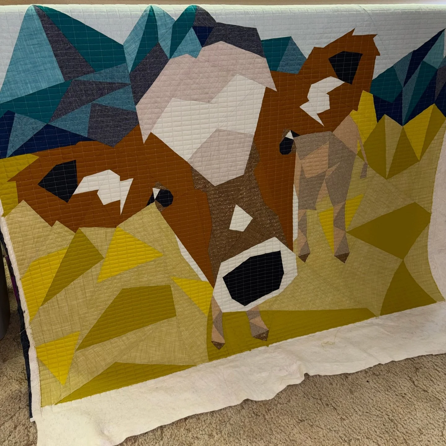 Another look at Ann's amazing quilt! This time, you get to see the stunning piecing that she did!

Combine that with some fabulous quilting texture and you get one of my favorite quilts ever!! This quilt is destined to be a wall hanging and it's defi