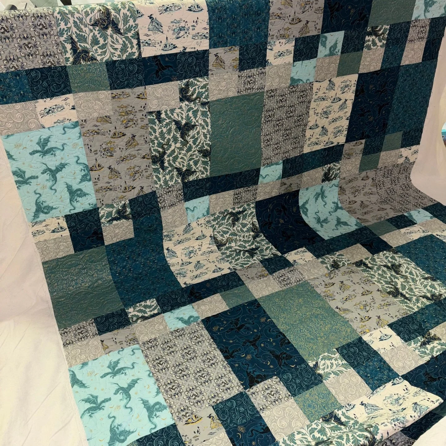 Marilyn is a member of my local quilting Guild and she dropped off this amazing quilt for me to quilt for her!

I LOVE the colors and the fabrics - they're so saturated, whimsical, and some of them are even metallic!

For the quilting, she chose the 