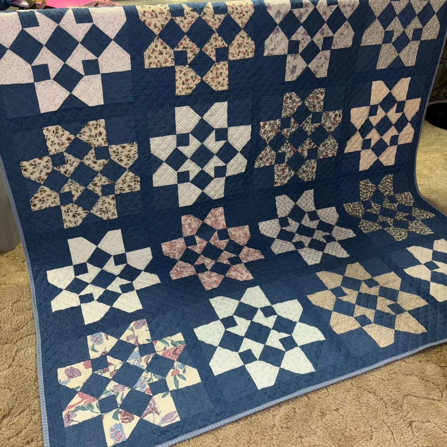 Emily made this amazing quilt for her mom's birthday and I was so honored to get to quilt it for her! Emily also asked me to bind the quilt for her so she received a quilt that was finished and ready to gift!

I love the bold blocks in prints with a 