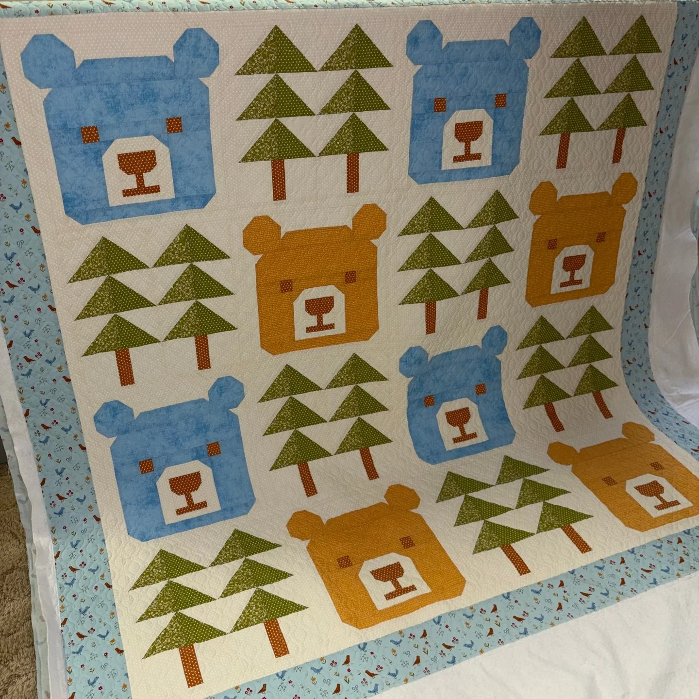 Janet always makes amazing quilts and this one is amazing and adorable! When Janet found out she had her first grandbaby on the way, she started dreaming up quilts and I loved getting to quilt them for her!! This is the first one she made!

I love th