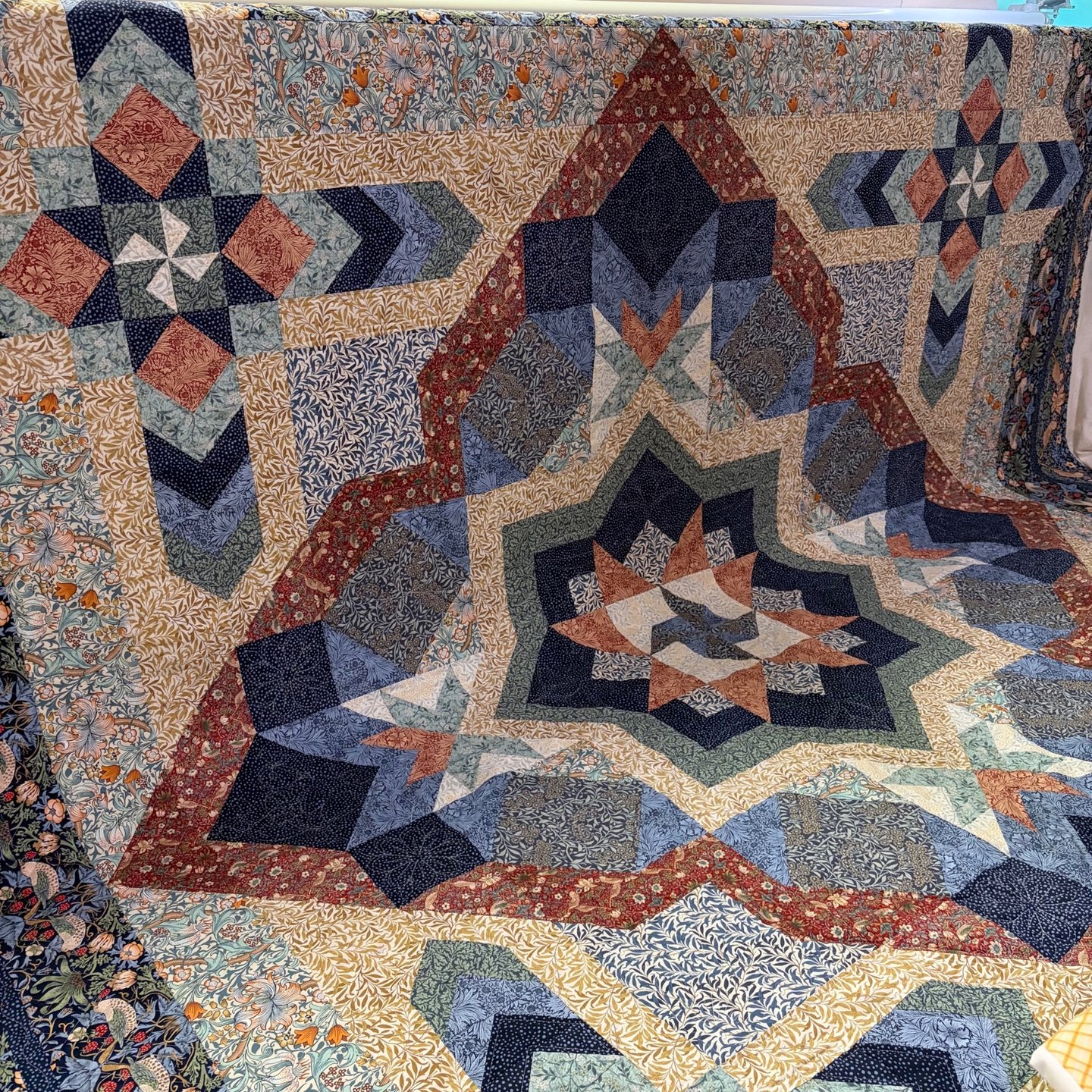 Jeanne sent this Morris Medley quilt to me and asked me to custom quilt it for her! I had so much fun doing some ruler work and placing some blocks and motifs throughout the quilt!

I think the end result really compliments her quilt!

#pieceofhomequ