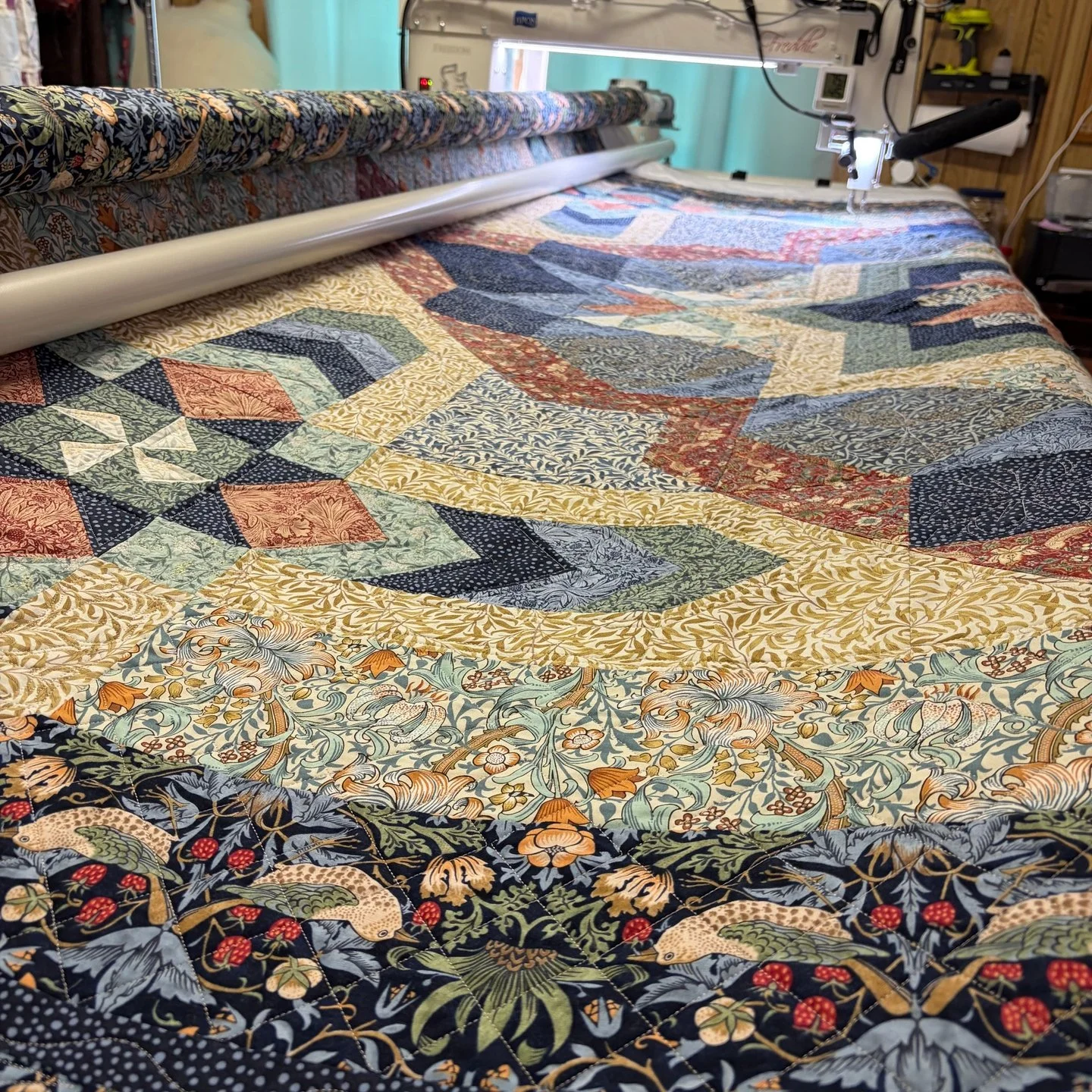 This is the largest custom quilt I've ever done! I had so much fun flexing new muscles in designing and quilting this custom quilt!

I added a combo of ruler work and placed motifs to complete this quilt. I love how it turned out! Thank you so much f