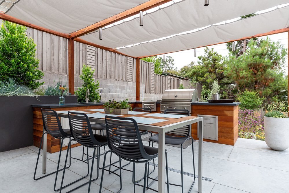 Welcome to the perfect setup for a summer bbq in this custom outdoor kitchen with gorgeous cedar accents. 
&bull;
&bull;
&bull;
#landscapearchitecture #firepit #dreamhome #beforeandafter #landscapedesign #contemporarydesign #beauty #landscapeconstruc