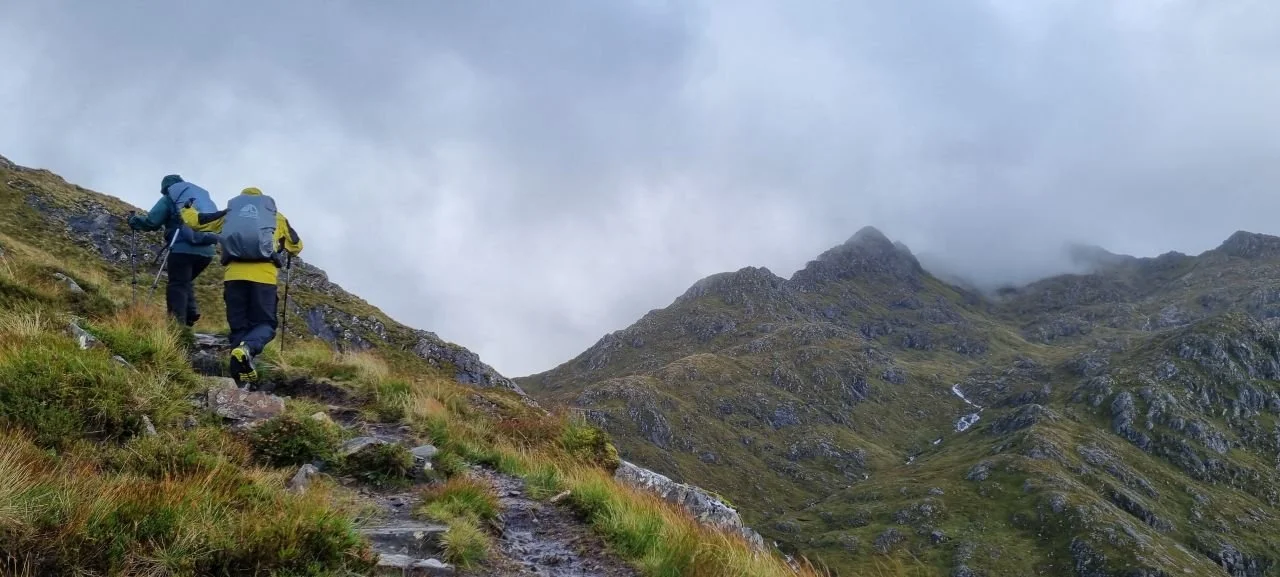 Walkers on the left, heading towards Forcan ridge, The Saddle, Kintail