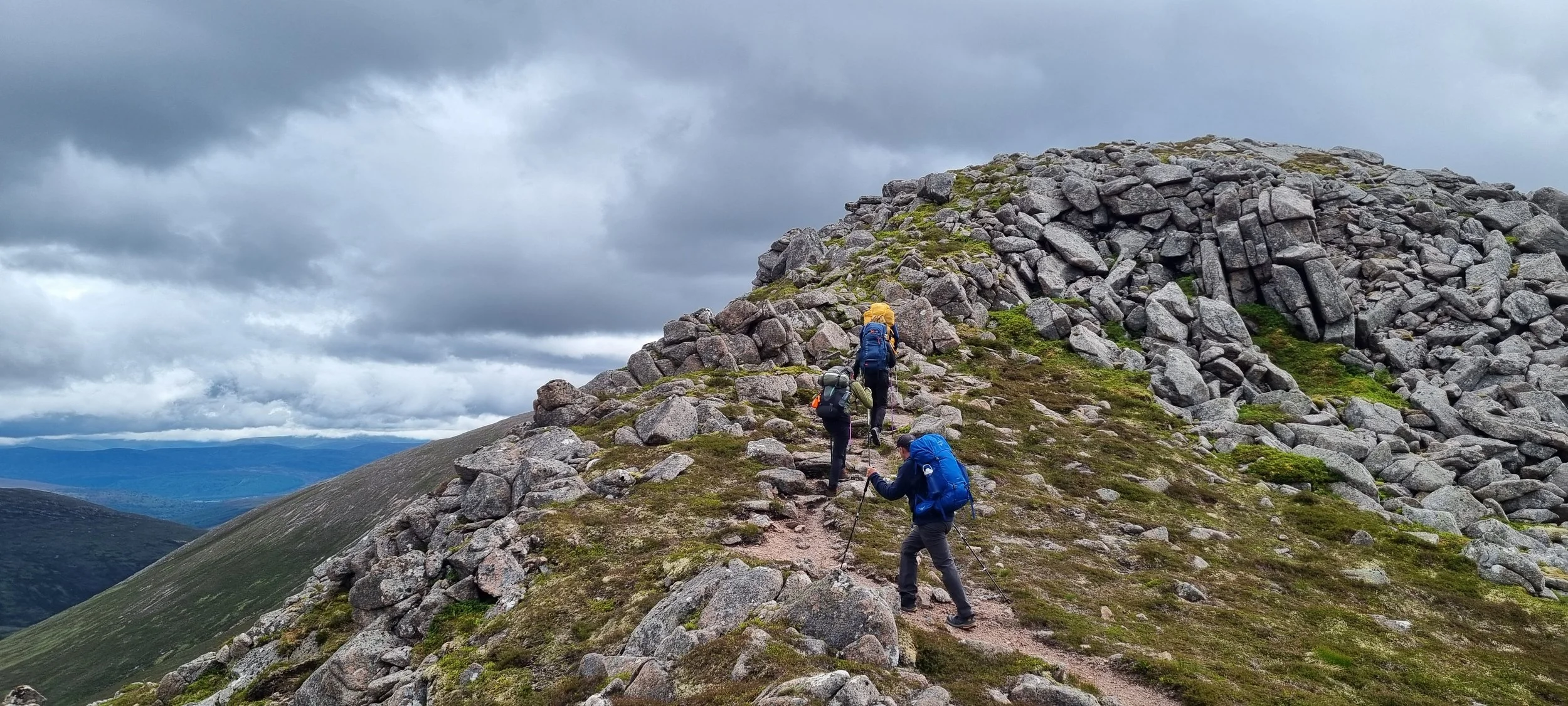 Walking to the summit of Cairn a’Mhaim on an expedition