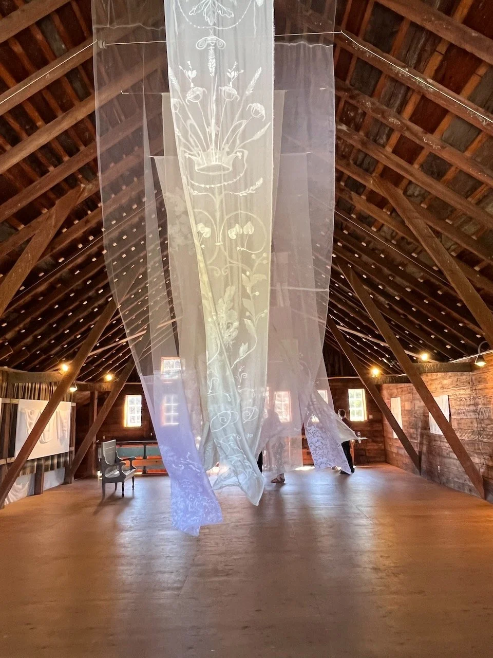 Eidolon (Installation View)  2025  204" x 48" (aprox. size of ea. Banner)   Mixed media on Fabric