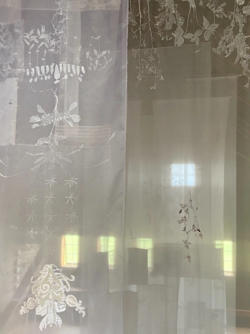 Eidolon (Installation View)  2025  204" x 48" (aprox. size of ea. Banner)   Mixed media on Fabric