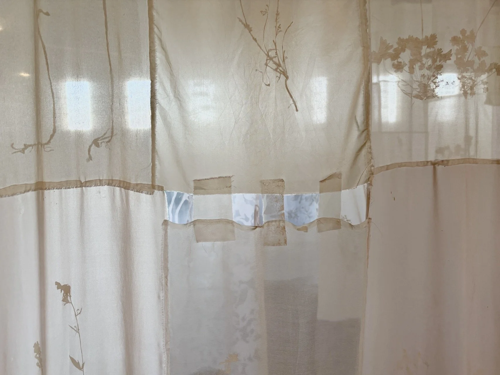 Eidolon (Installation View)  2025  204" x 48" (aprox. size of ea. Banner)   Mixed media on Fabric