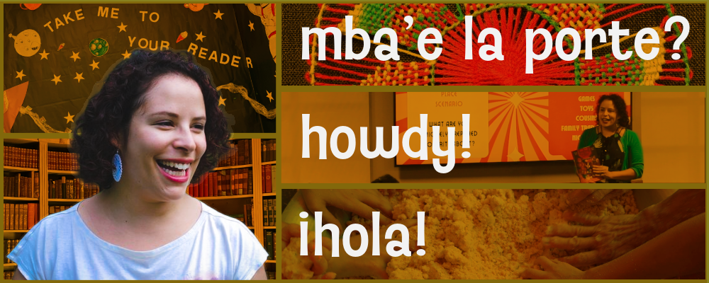 A smiling woman with curly hair and blue earrings, standing in front of a bookshelf and a decorated classroom with space-themed decorations, including planets and stars, holding a book. Text overlays include "mba e la porte?", "howdy!", and "hola!"