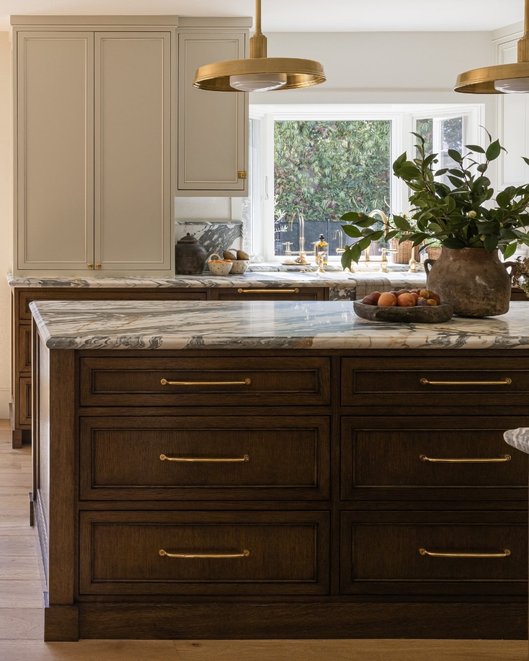 The materials in a kitchen shape the way life unfolds inside it. Our recent Summer Breeze remodel is layered in warmth and coziness. It is fit for slow mornings with the kids, holiday gatherings, potlucks with friends, off-key birthday songs around t