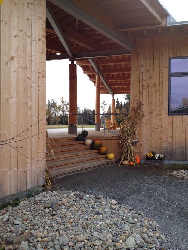  Alright, let’s start at the front of the building as you approach from Tamarack. The large central deck connects the two wings of the building. Here, the gym/fitness area is on the left, while the touring center and lodge is on the right. 
