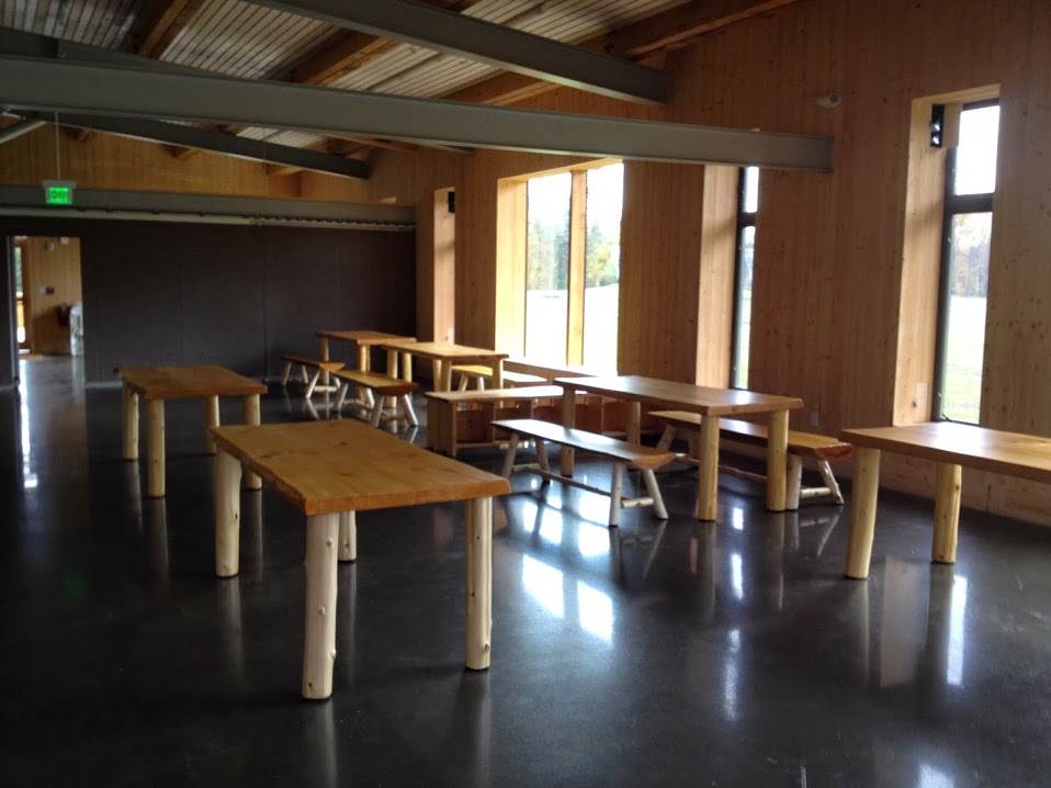 Here is part of the main lodge space, adjacent to where the rentals will be. The tables and benches were hand-crafted on site from mostly local wood.     