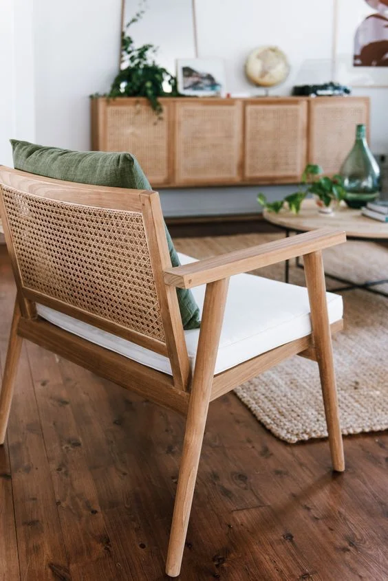 Woven rattan chair and light oak coffee tables