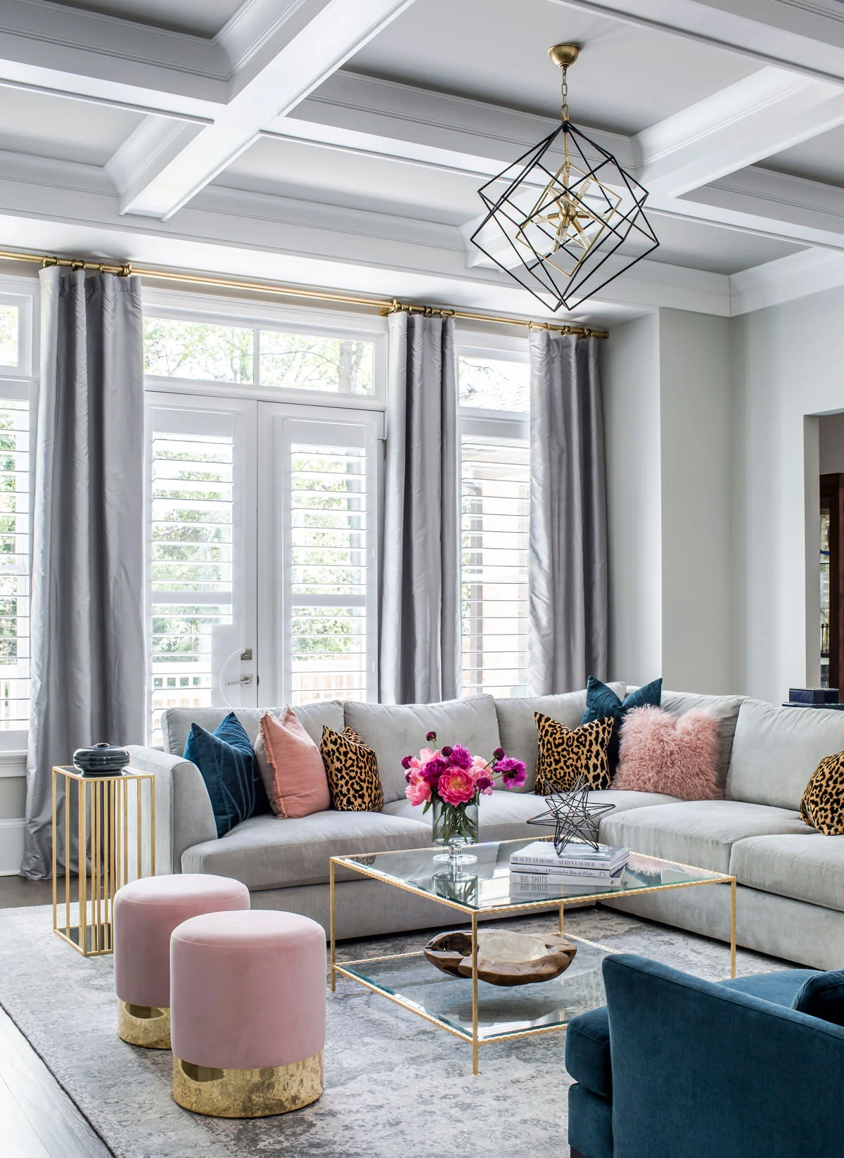 Family room with velvet furniture and brass accents
