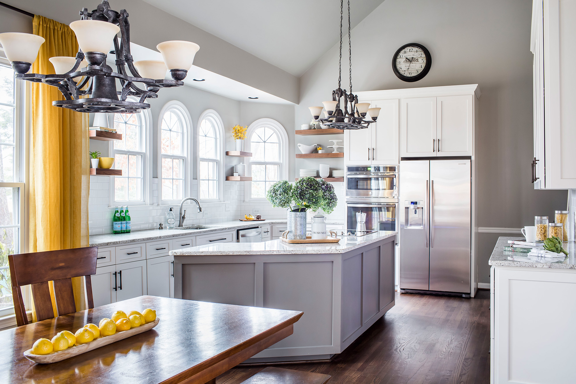 Transitional grey and yellow kitchen with stainless steel appliances