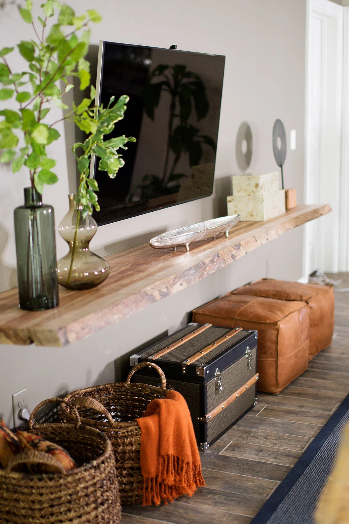 Reclaimed wood ledge with storage baskets underneath