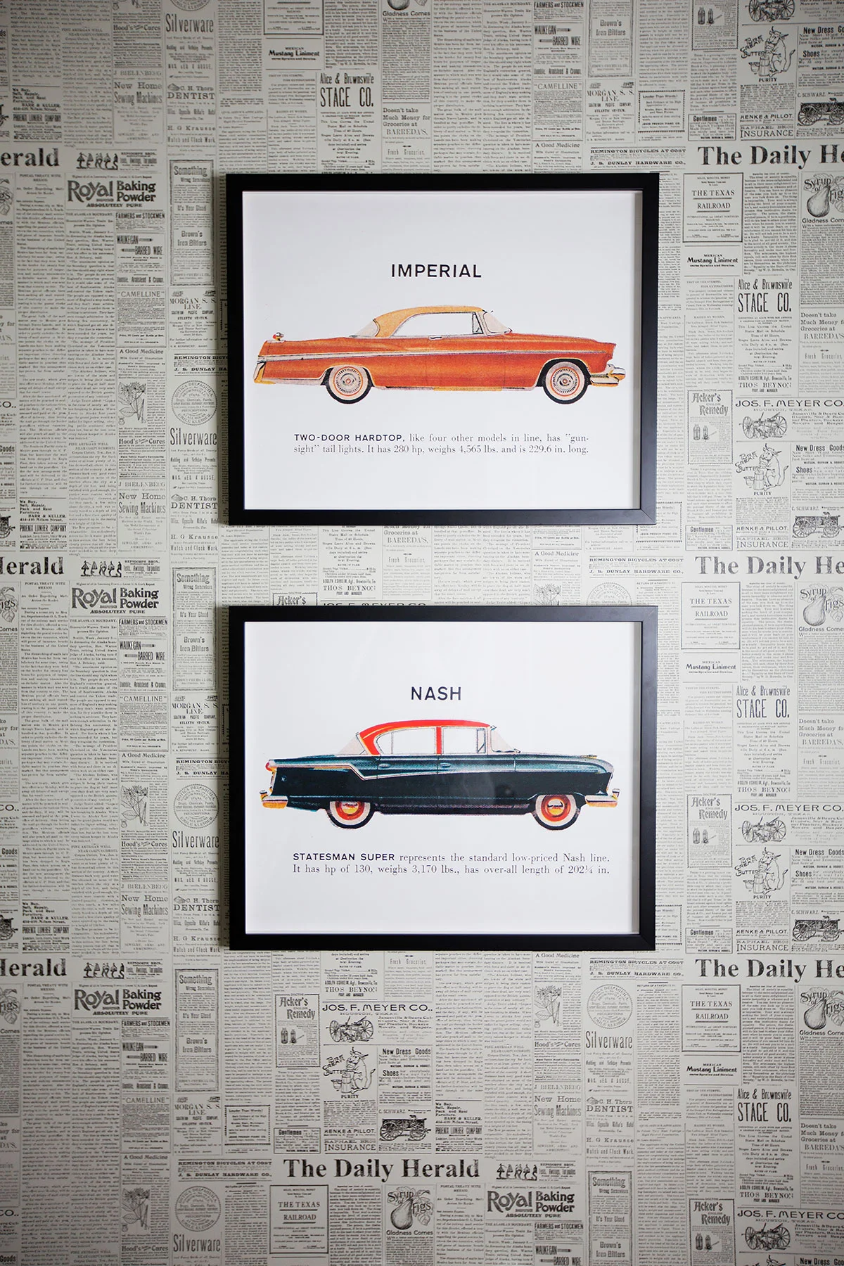 Powder room with newsprint wallpaper and car artwork