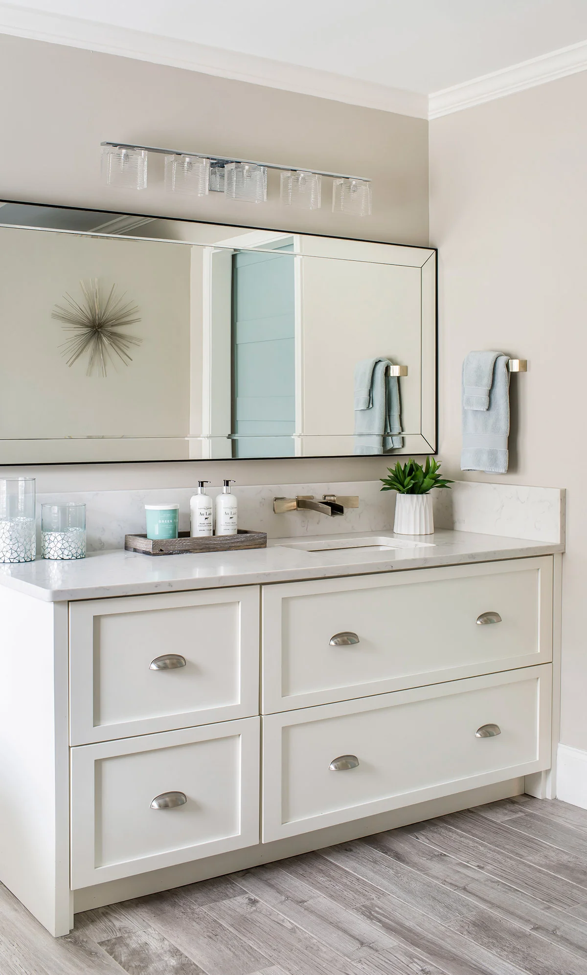 Built-in vanity with marble countertops and nickel hardware