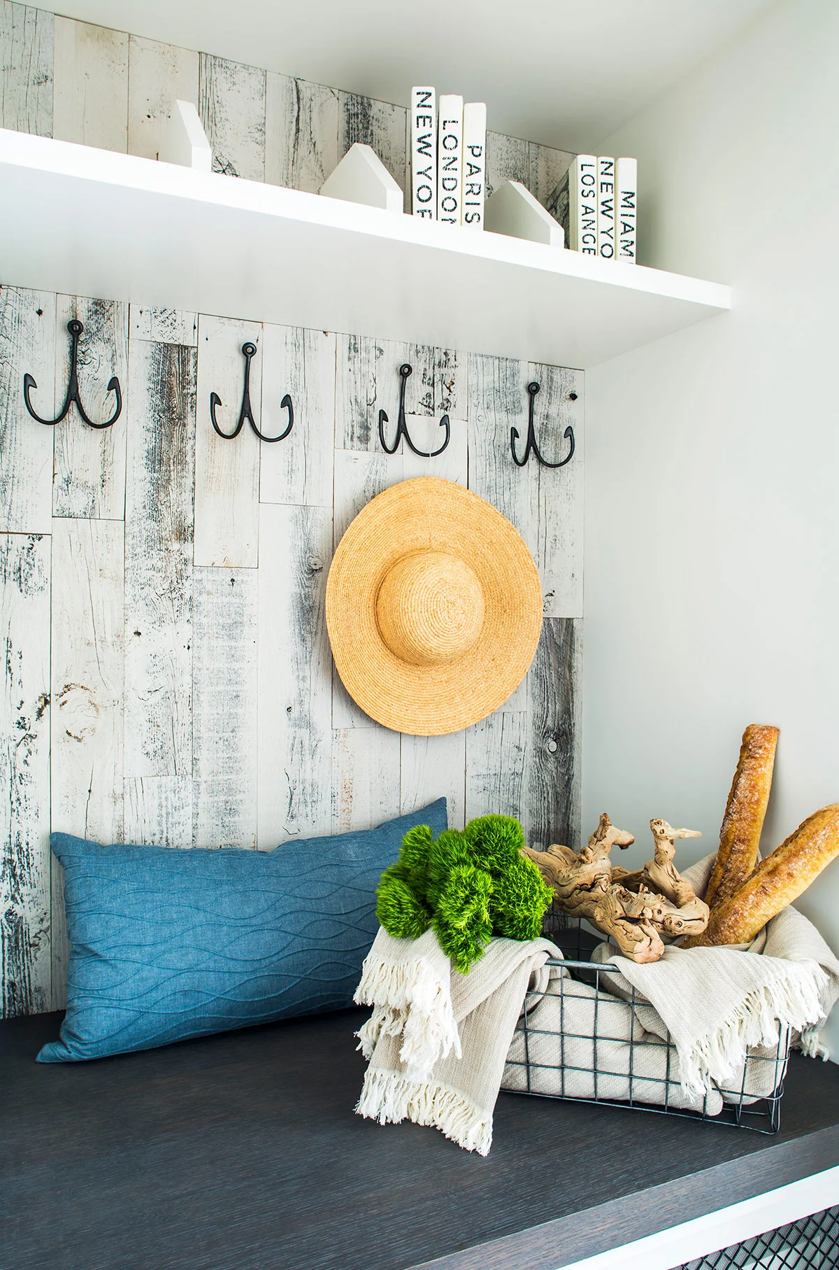 Coastal inspired mudroom with wood paneling