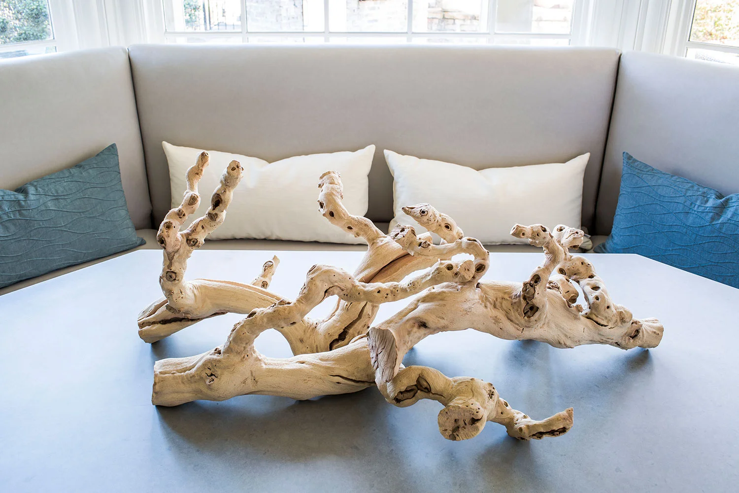 Driftwood accessorizes the breakfast nook table