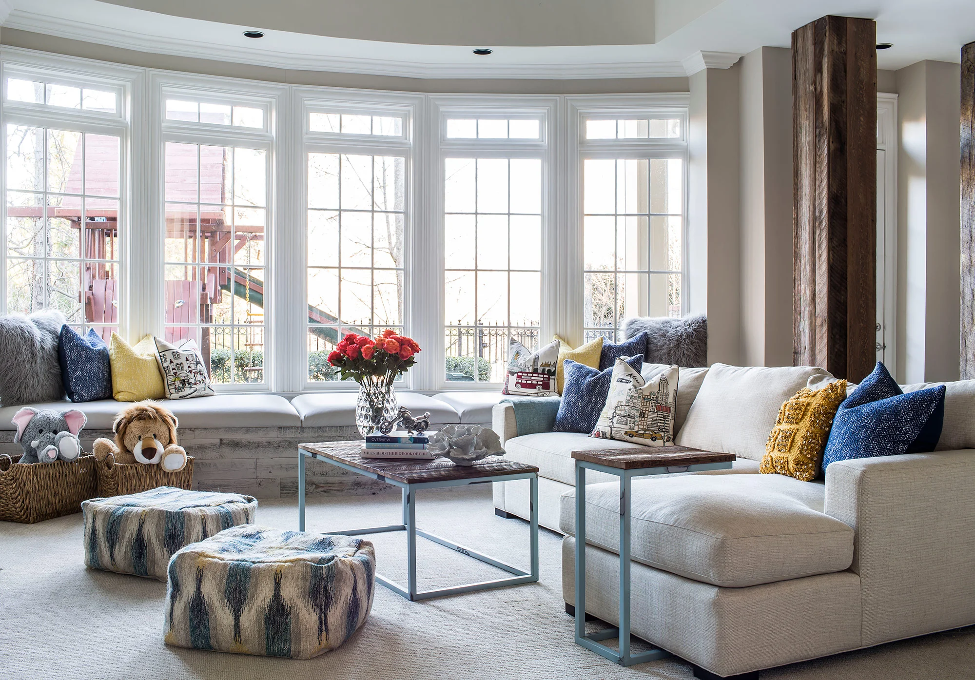 Contemporary rustic basement with reclaimed wood columns and casual, kid-friendly decor