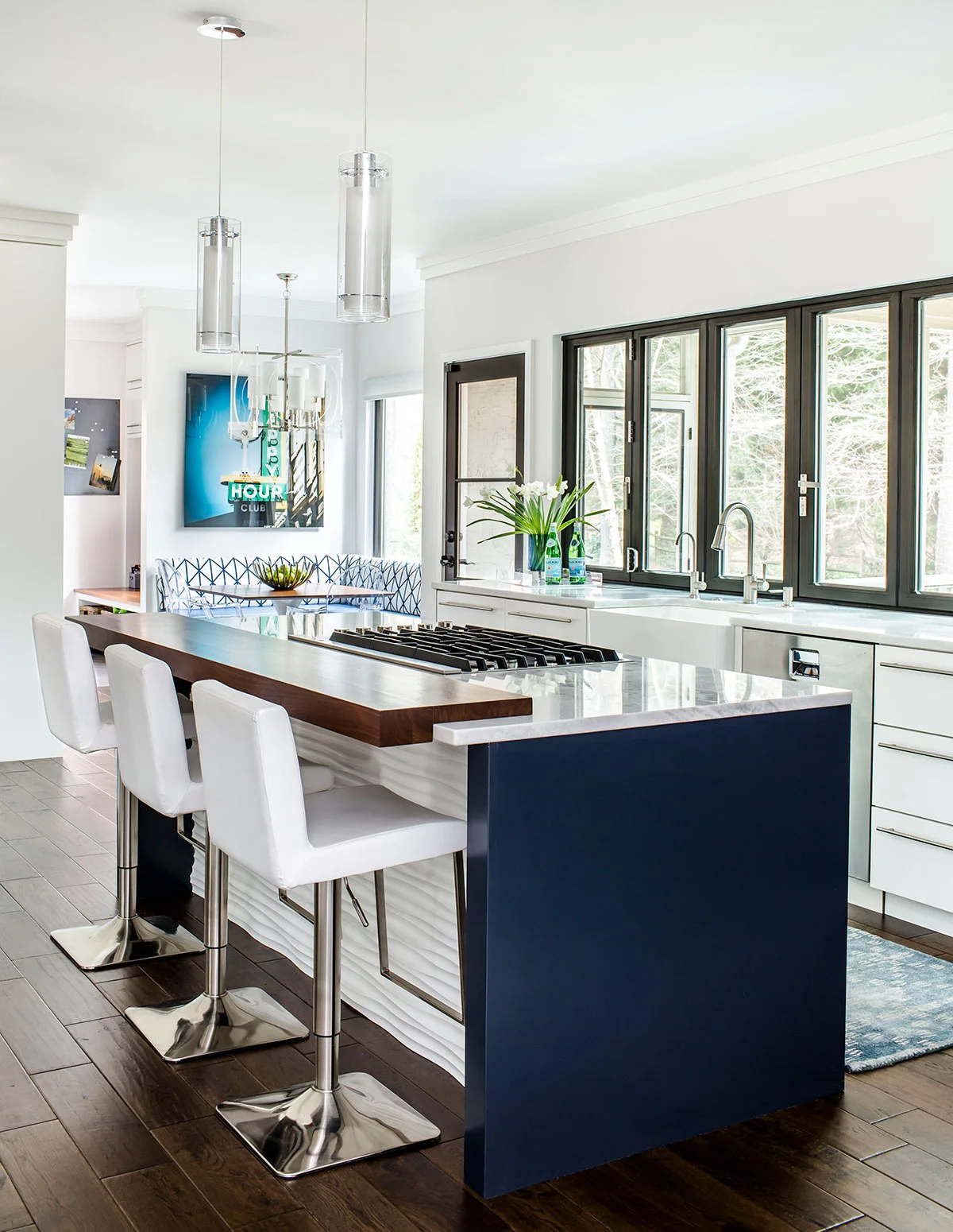 Contemporary kitchen island with gas range and wood counter