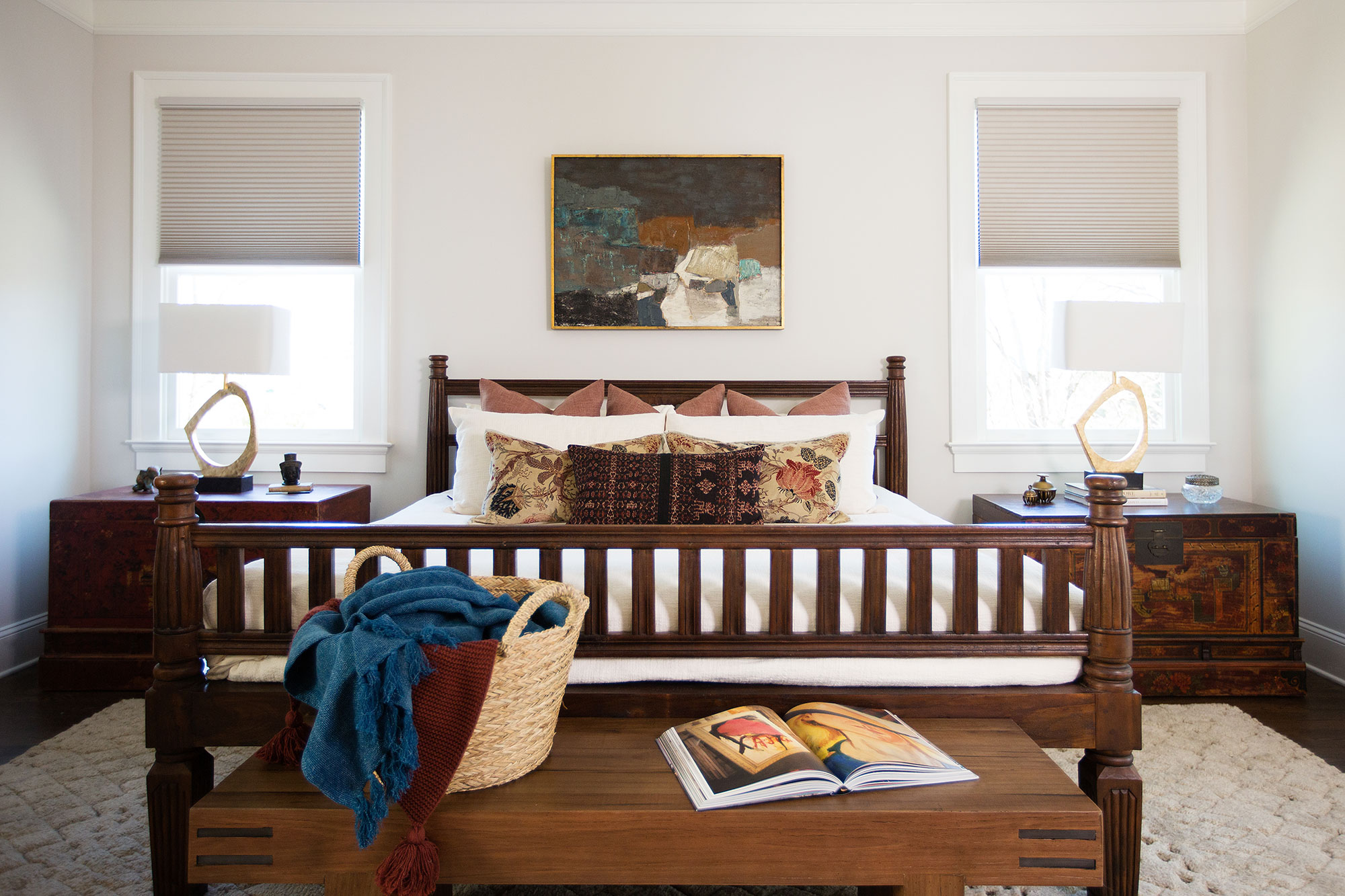 Master bedroom featuring antique and globally sourced furniture