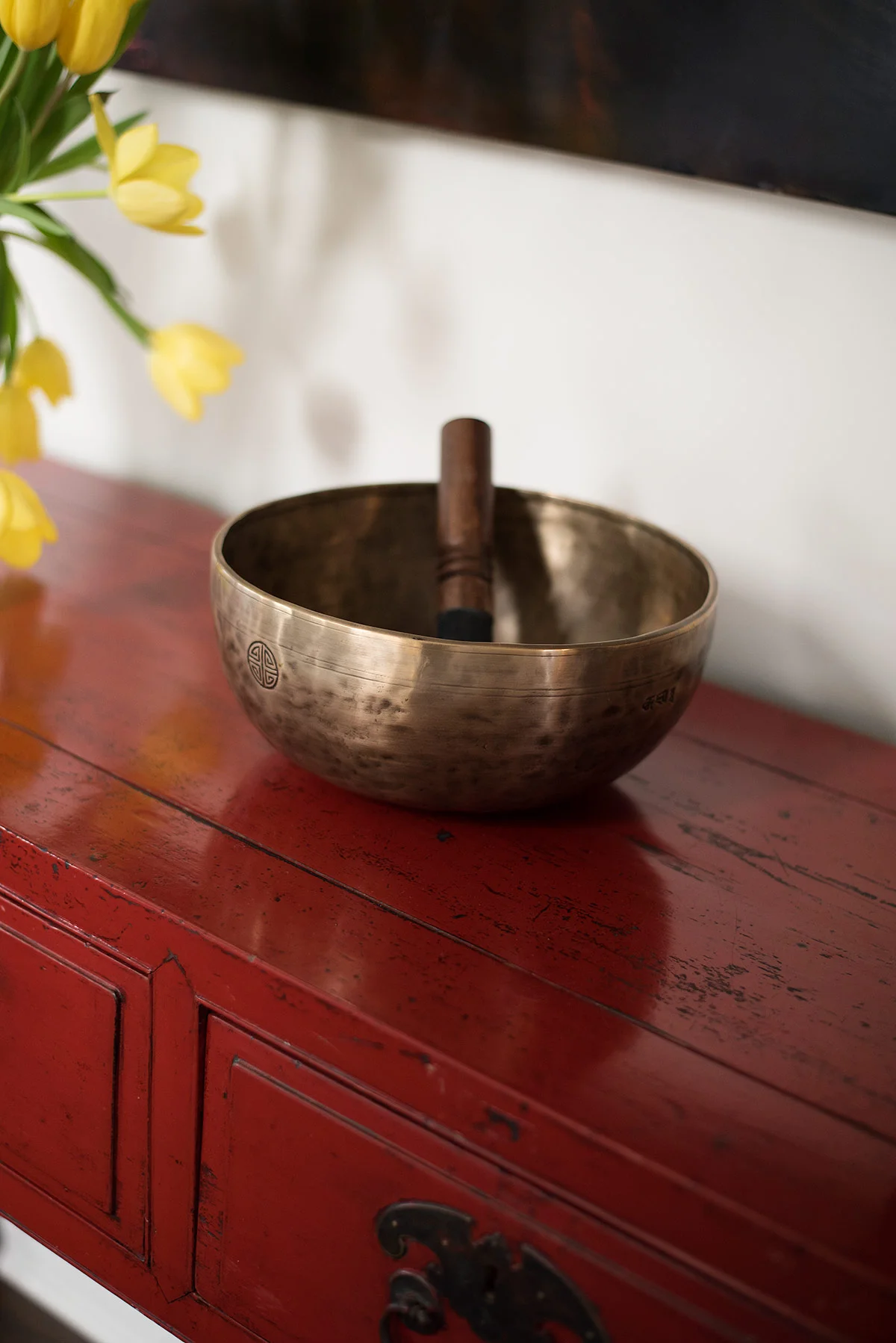 Antique red console table, with Tibetan singing bowl