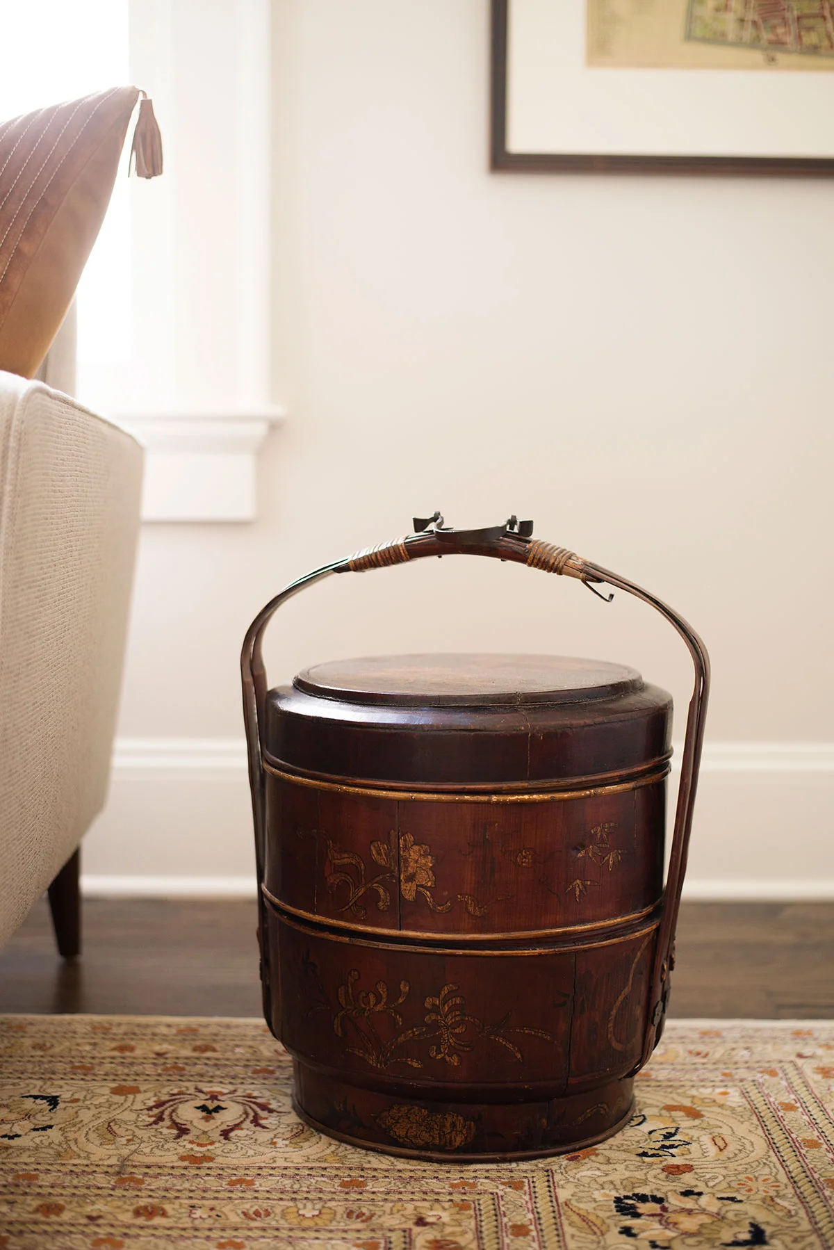 East Asian antique bucket used as side table