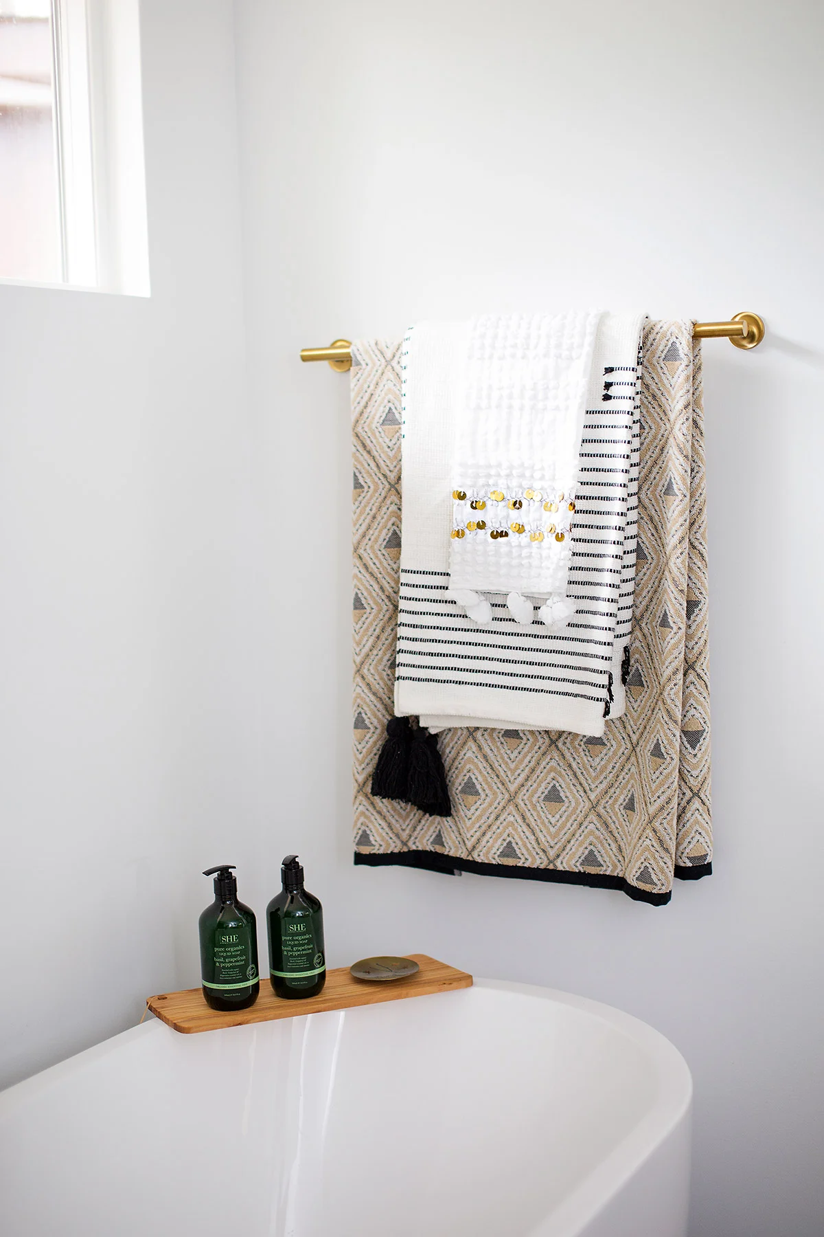 Freestanding tub in midcentury modern master bathroom