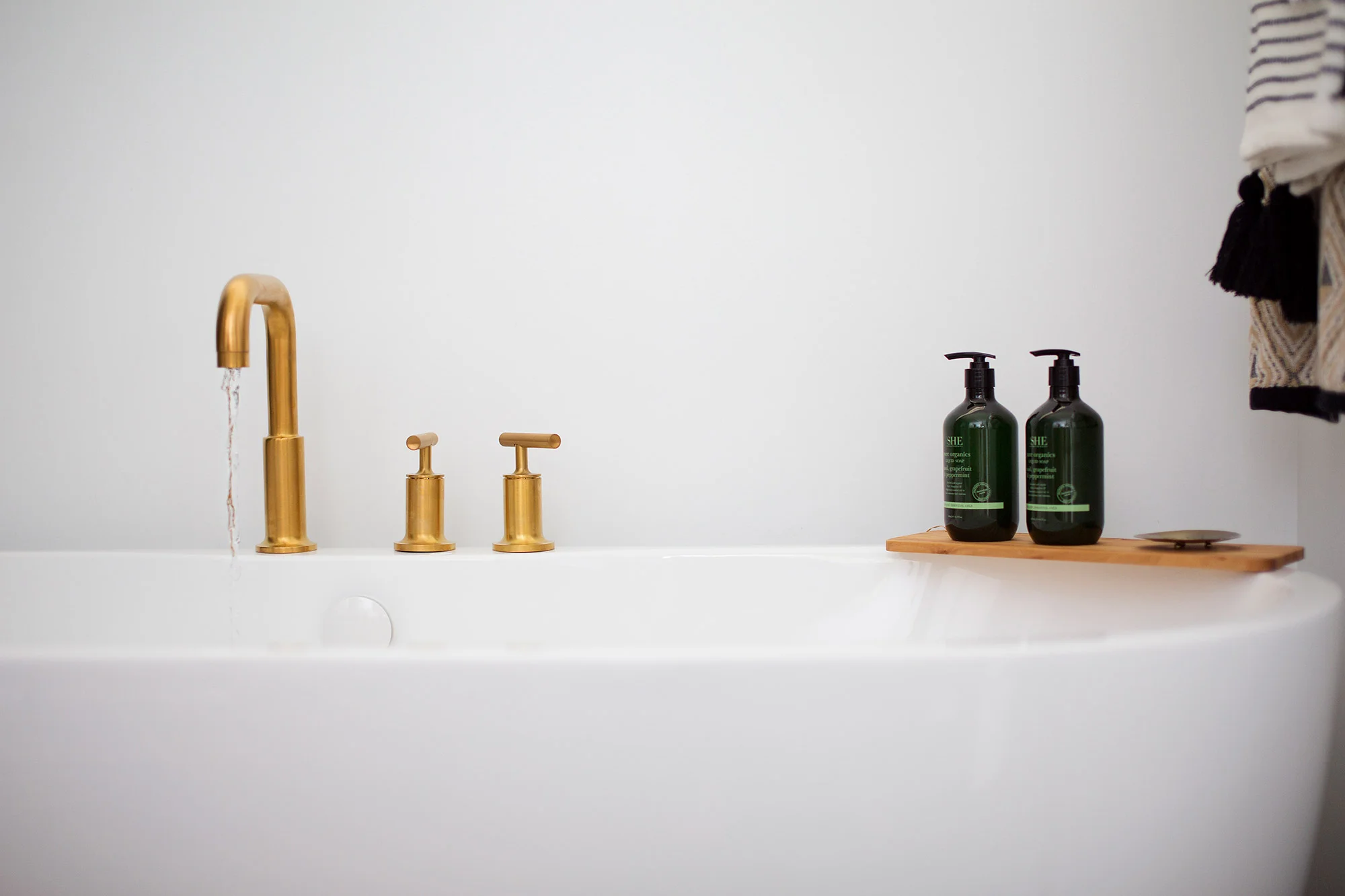 Freestanding tub in midcentury modern master bathroom