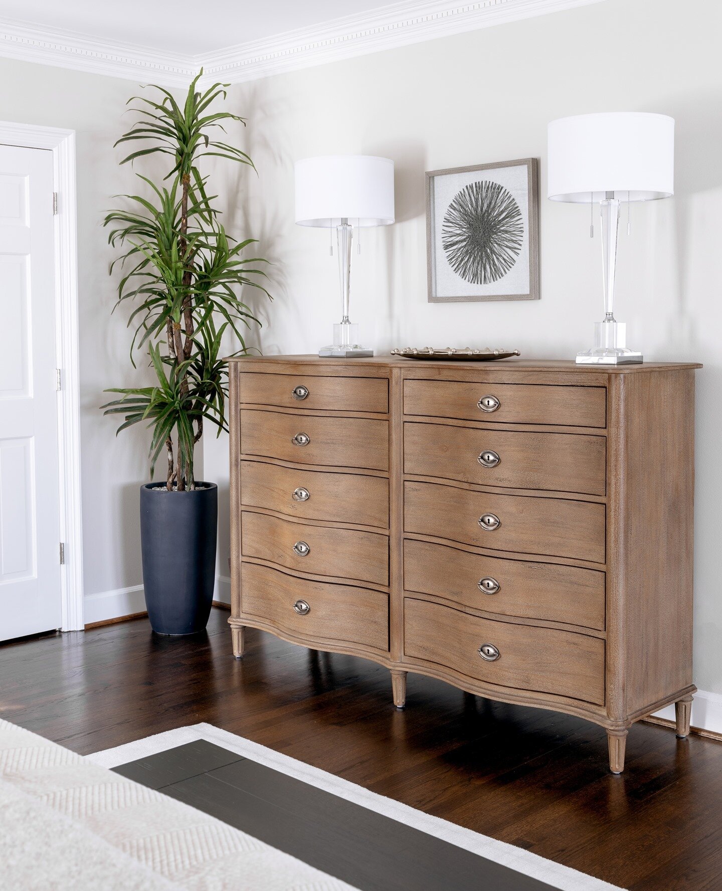 Stylish storage pieces are a must in any room. This tall, vintage inspired dresser adds both character and functionality to this clean transitional bedroom space - and when your clients are tall, the furniture choices have to work accordingly! Dressi