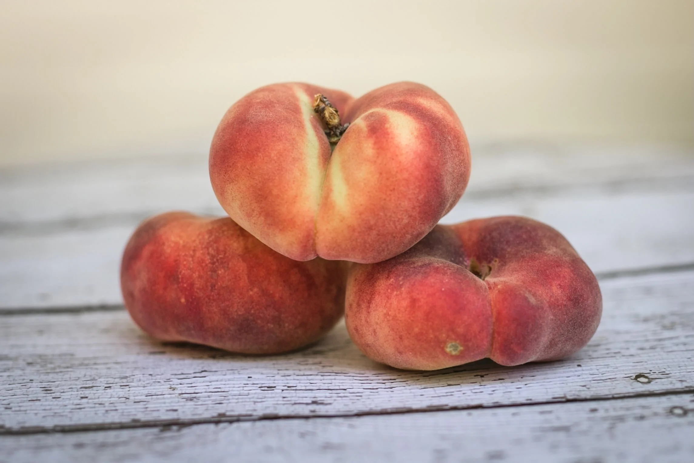 Donut Peaches! They get their name from their shape. Truly, the sweetest, juiciest, peach you have ever tasted.