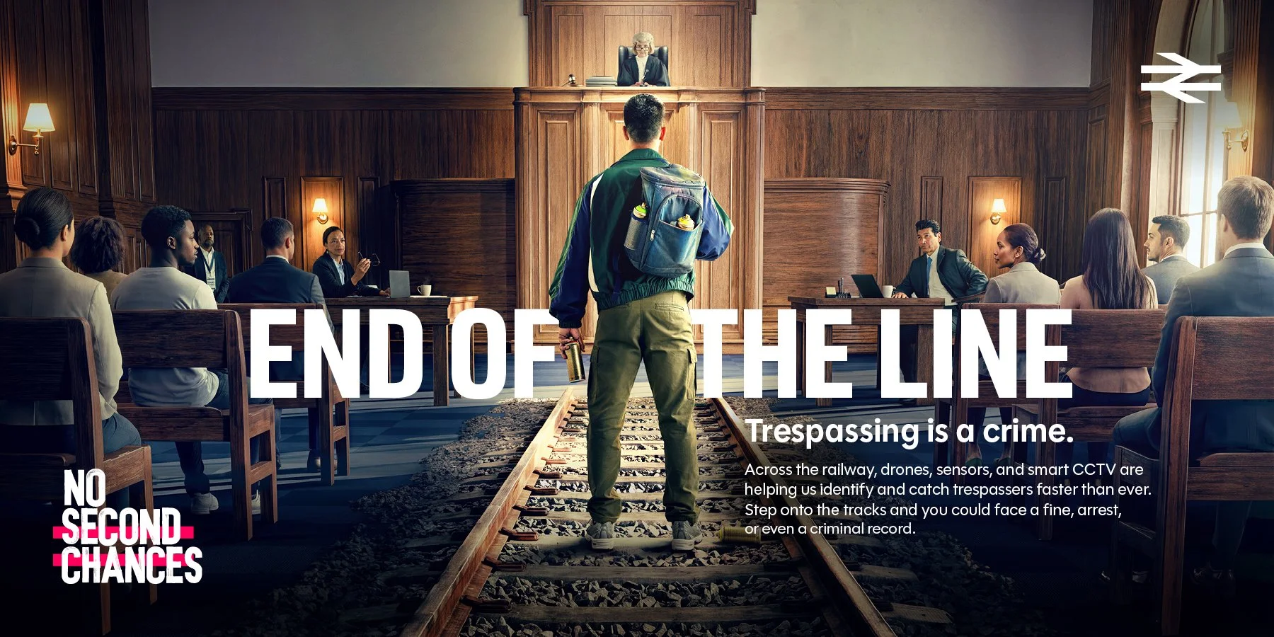 National Rail “End of the Line” advert showing a man on railway tracks inside a courtroom, warning that trespassing is a crime.
