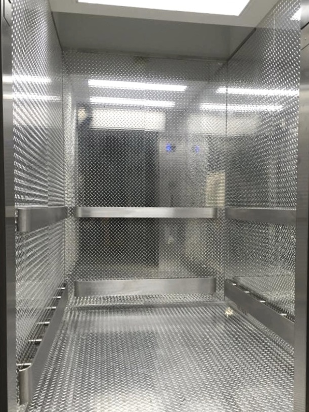 Installed aluminum treadplate wall panels and flooring, brushed stainless steel handrails and bumper rails also installed new lighting fixtures.
