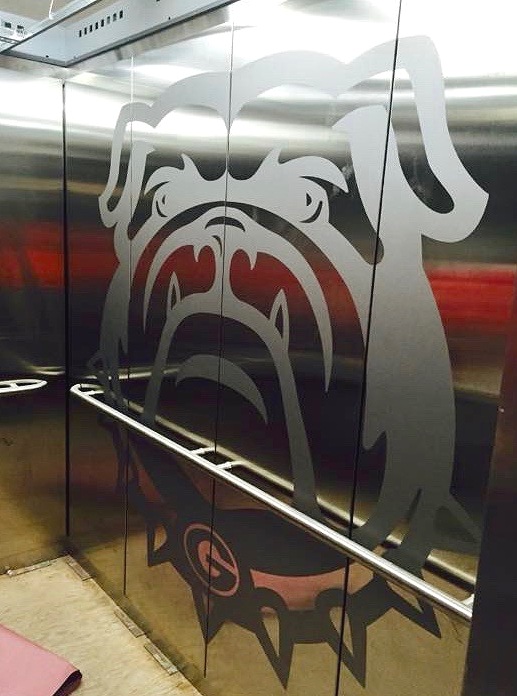 Sanford Stadium - Installed brushed stainless steel wall panels.